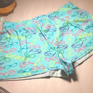 14/16 pj shorts covered in a neon glasses design